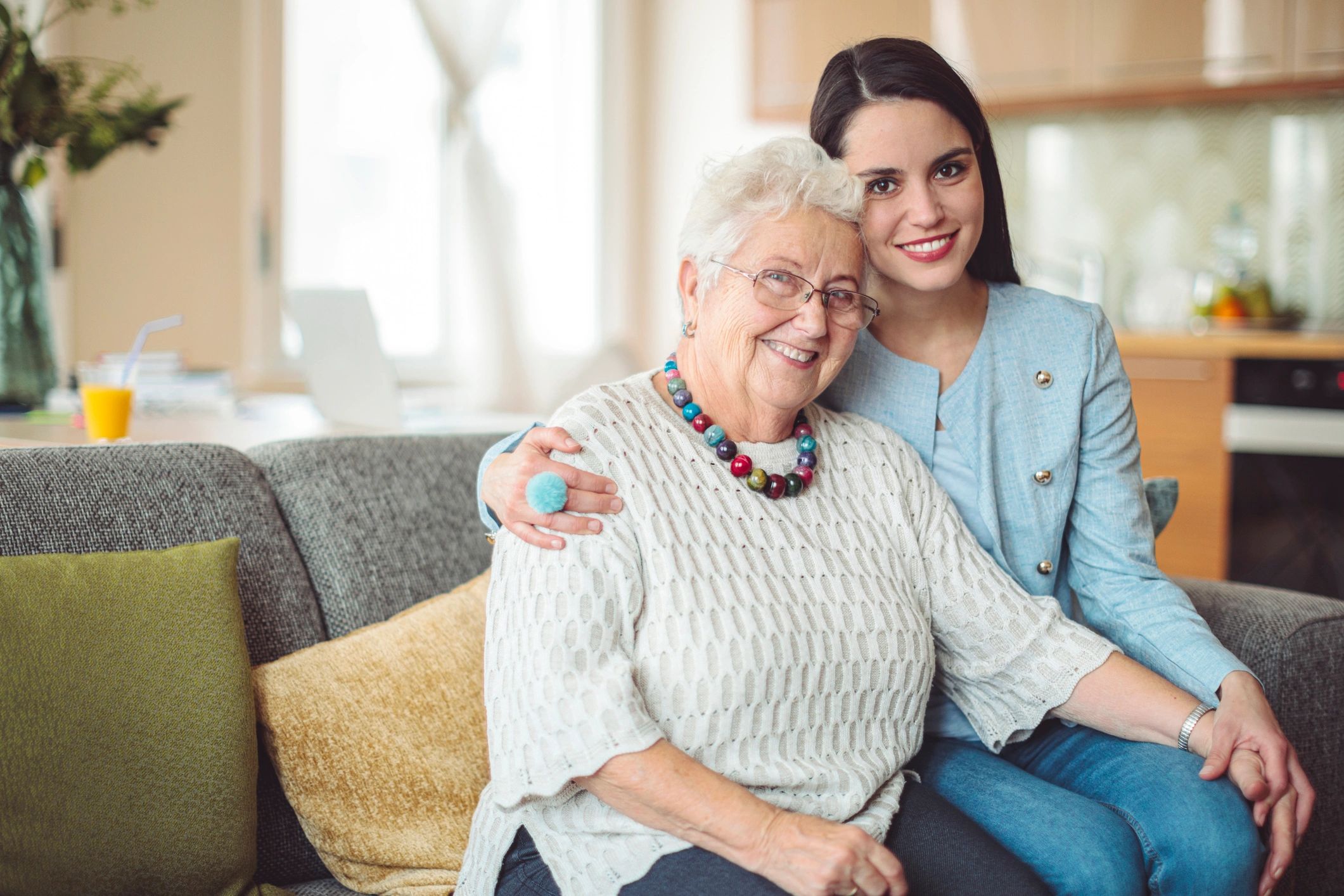 Home care professional visiting a senior woman at home